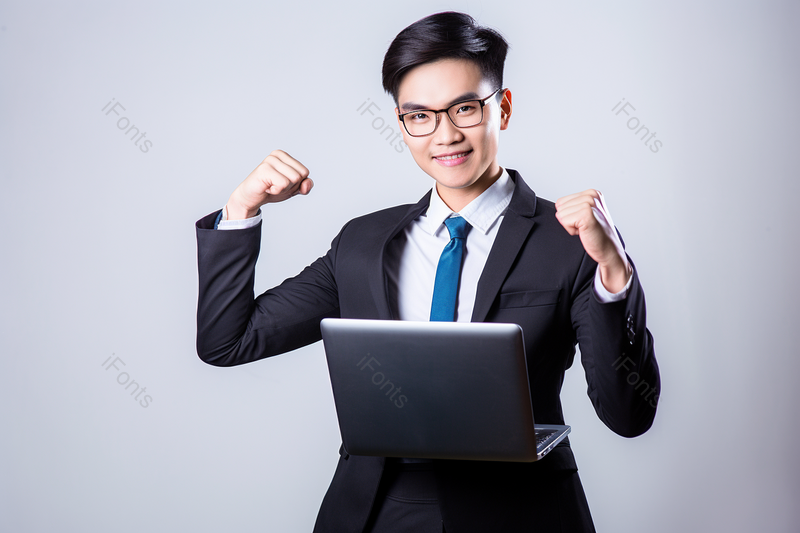 商务男士拿着电脑庆祝成功,高清,摄影图,摄影图片,图片大全,摄影图免费下载